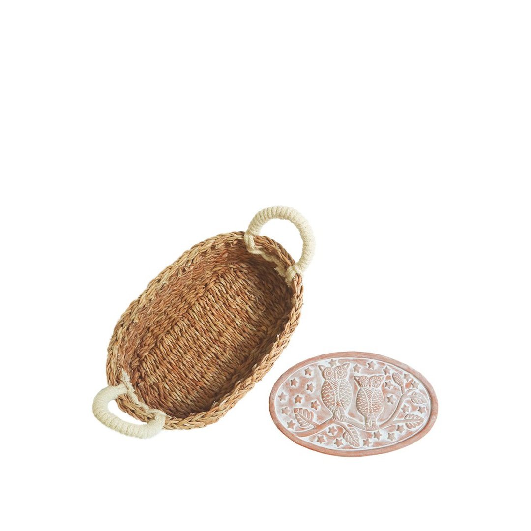 Bread Warmer & Basket - Oval seagrass bread basket and terracotta plate with owls sitting on a branch
