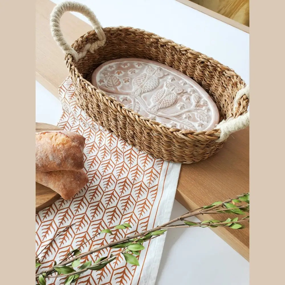 Owl Oval Terracotta Bread Warmer and Bread Basket with bread on a wooden tray