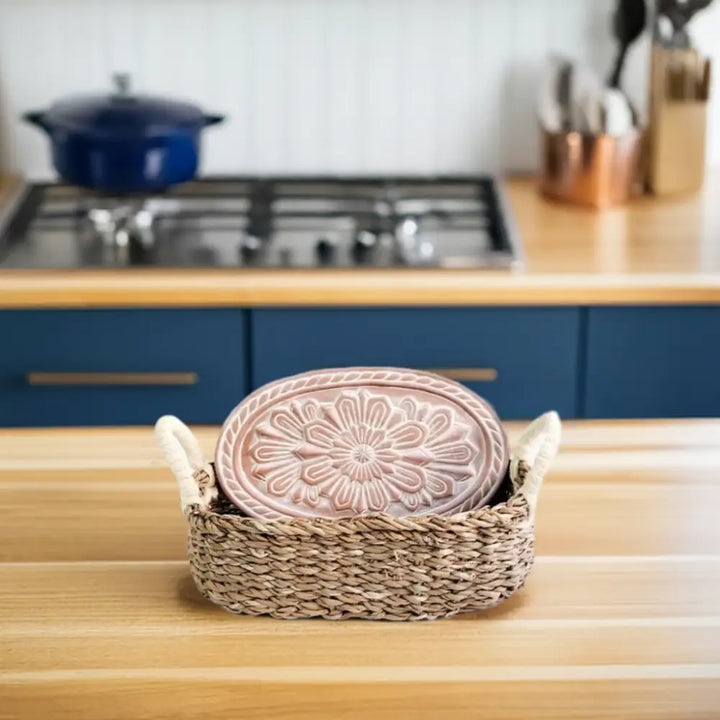 Decorative terracotta bread warmer in basket with floral pattern for bread lovers