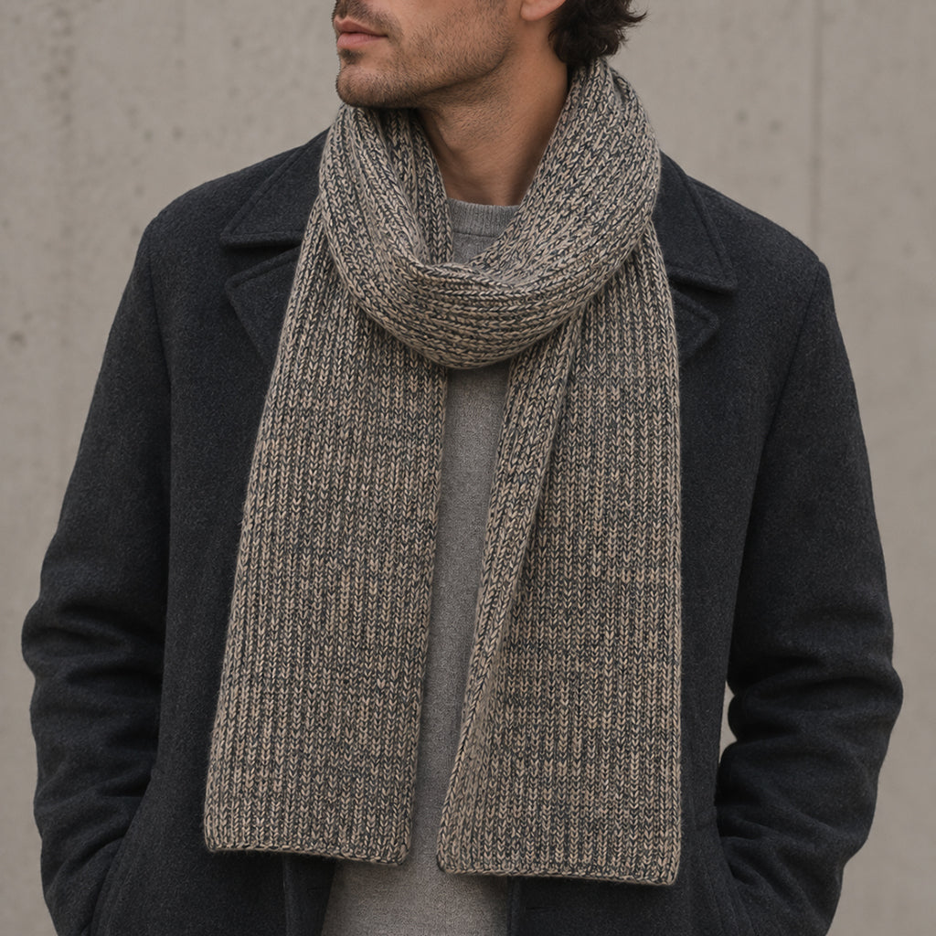 Charcoal and soft brown Himalayan cashmere scarf worn on a male model, with marled ribbed knit