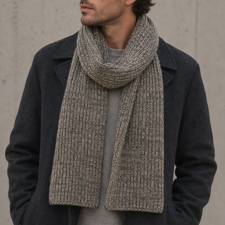 Charcoal and soft brown Himalayan cashmere scarf worn on a male model, with marled ribbed knit