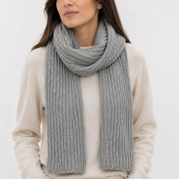 Himalayan cashmere scarf in Classic gray, featuring ribbed knit worn by a model