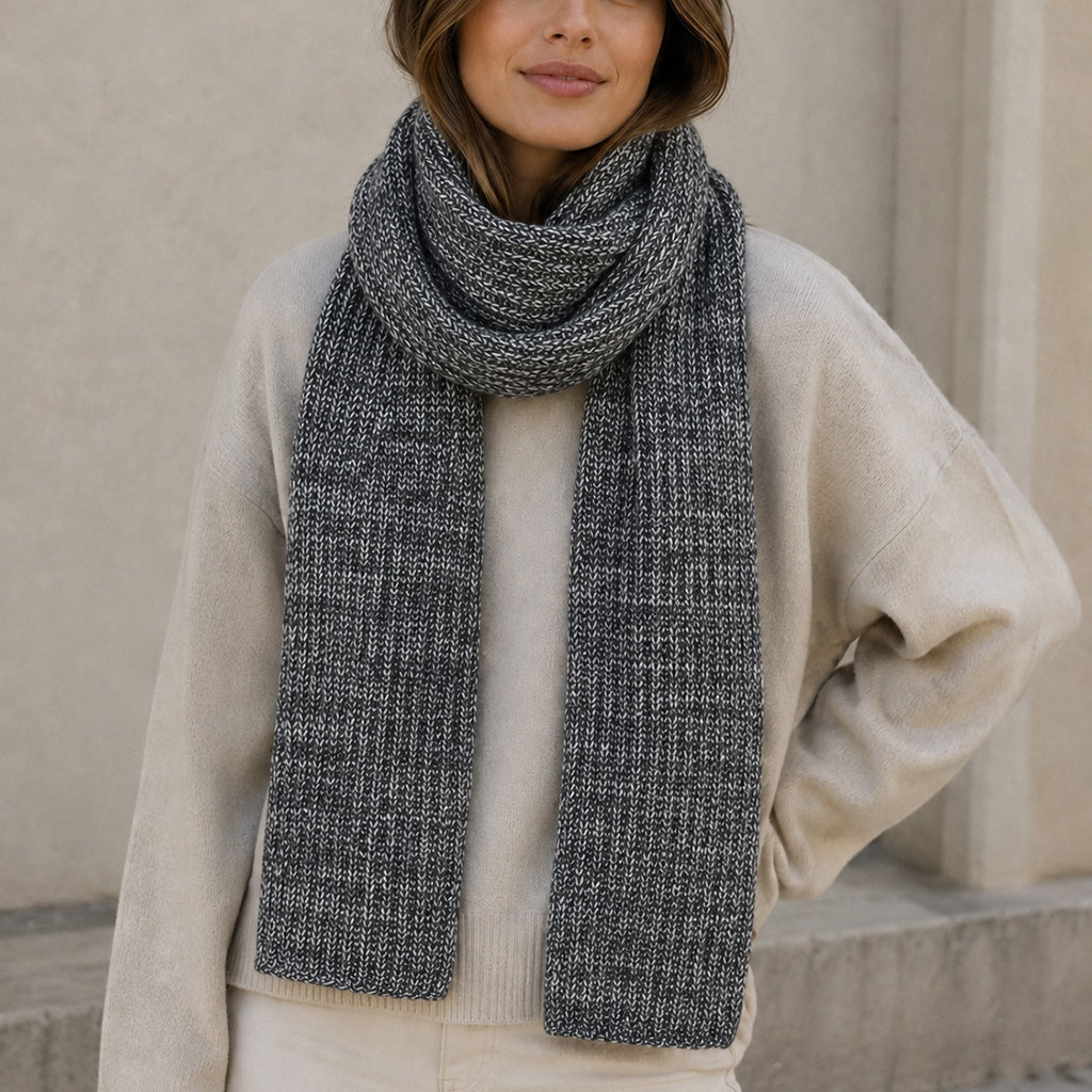 Himalayan cashmere scarf in Charcoal and soft gray, featuring marled ribbed knit on a model