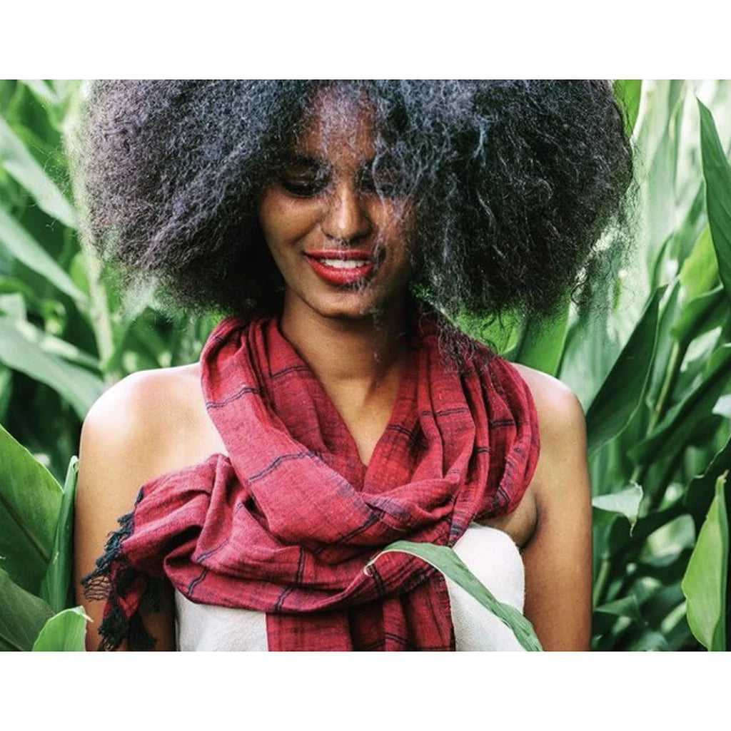 Merlot cotton scarf with stripes on a black warp worn by a woman